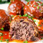 Close-up cut-open pork and black pudding meatball with tomato sauce featuring a title overlay.