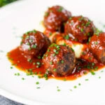Minced pork and black pudding meatballs with tomato sauce and mashed potato.