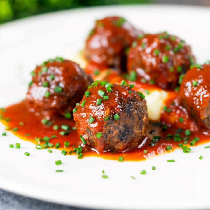 Pork and black pudding meatballs in a beer and tomato sauce served with mashed potato.