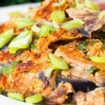 Close-up UK Chinese takeaway style chicken egg foo yung omelette.