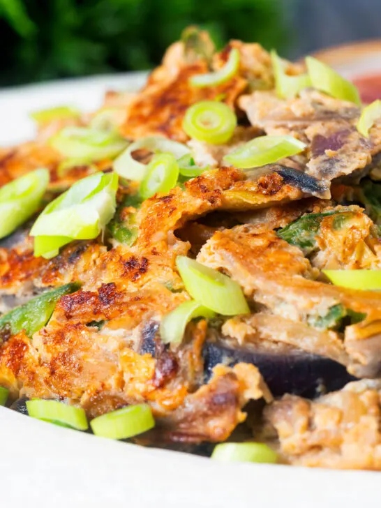 Close-up UK Chinese takeaway style chicken egg foo yung omelette.