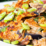 Close-up UK Chinese takeaway style chicken egg foo yung omelette featuring a title overlay.