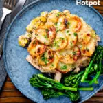 Overhead scalloped potato topped creamy chicken and leek hotpot with roasted tenderstem broccoli featuring a title overlay.