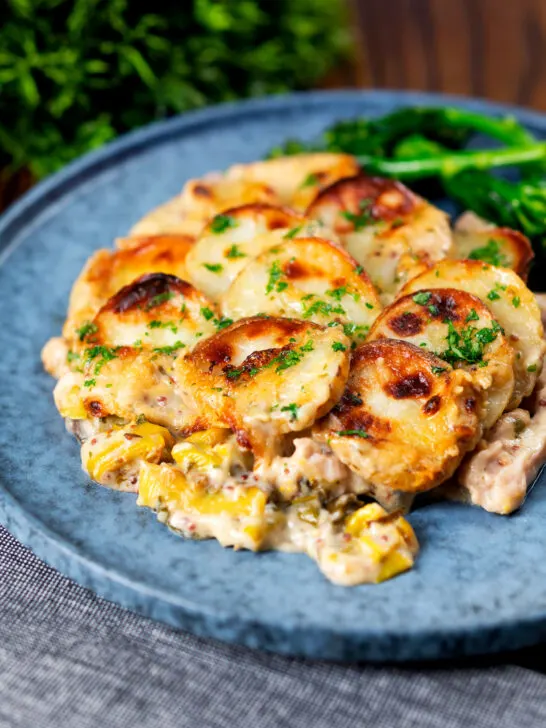 Scalloped potato topped creamy chicken and leek hotpot with roasted tenderstem broccoli.