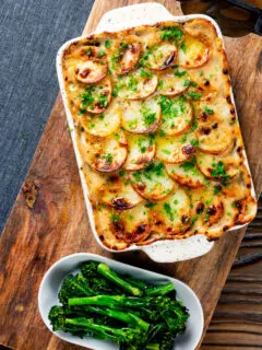 Overhead crispy potato-topped oven-baked creamy chicken and leek hotpot.