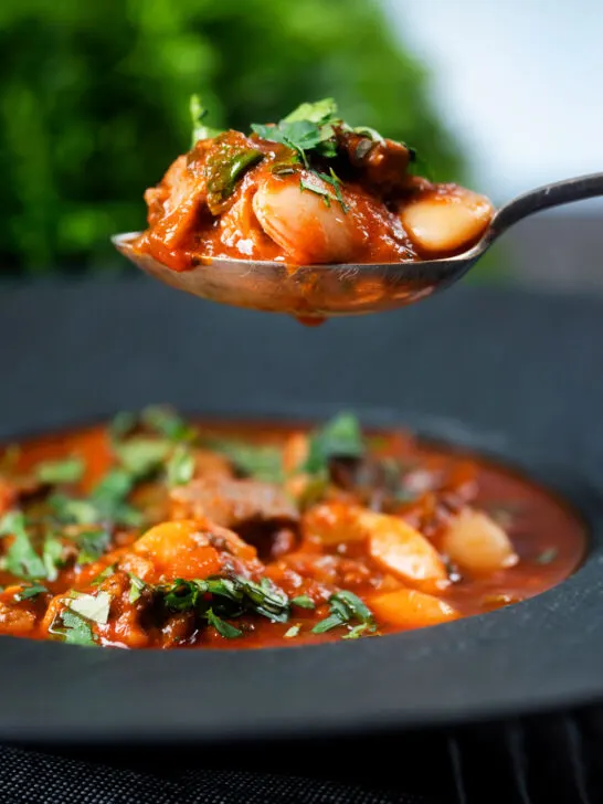 Fasolia, Lebanese-influenced lamb and butter bean stew one a spoon.