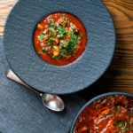 Overhead fasolia, Middle Eastern lamb and butter bean stew.