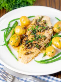 Whole pan-fried lemon sole meuniere with a caper and butter sauce.