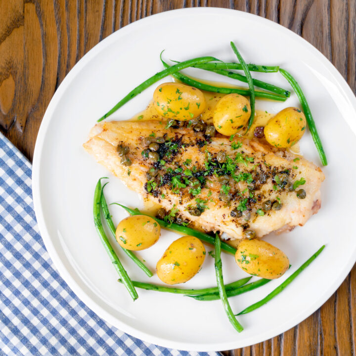 Pan fried whole lemon sole meuniere with parsley potatoes and green beans.