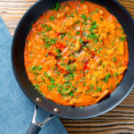 Overhead Hungarian pork paprikash served in its cooking pan.