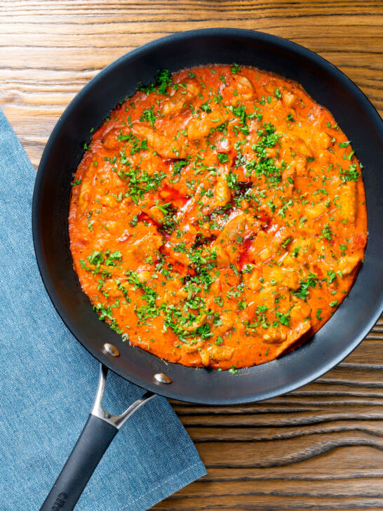 Overhead Hungarian pork paprikash served in its cooking pan.