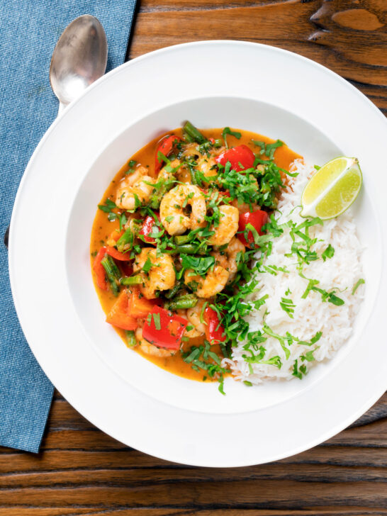 Overhead Thai prawn panang curry with jasmine rice and fresh coriander.