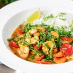Thai prawn panang curry with jasmine rice and fresh coriander.