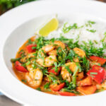 Thai prawn panang curry with jasmine rice and fresh coriander featuring a title overlay.