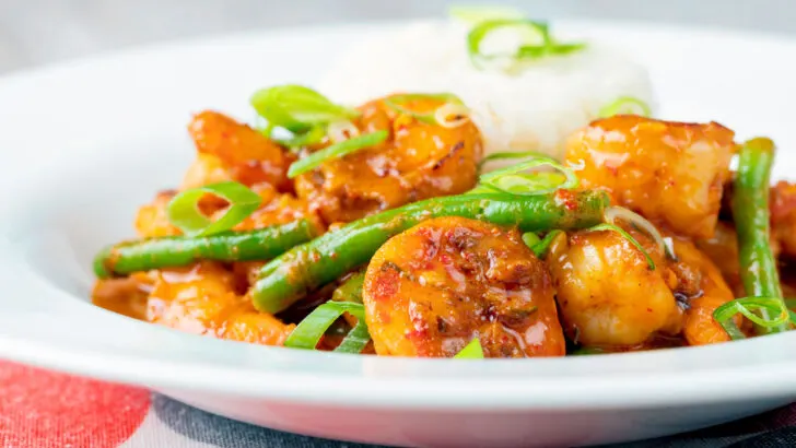 Thai red prawn or shrimp curry with green beans in a coconut milk sauce.