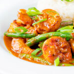 Thai red prawn curry with green beans served with rice.