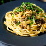 Tuna pesto pasta with crispy capers, golden breadcrumbs and fresh basil.