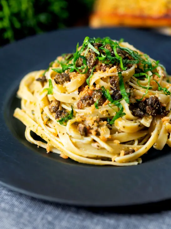 Tuna pesto pasta with crispy capers, golden breadcrumbs and fresh basil.
