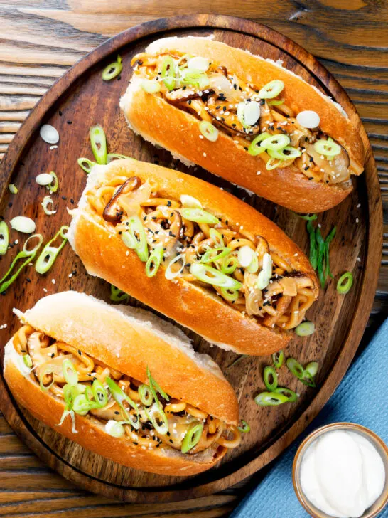 Overhead Japanese yakisoba pan, stir-fried udon noodles served in a hot dog bun.