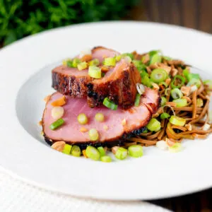 Baked tuna steak with a honey, soy sauce and ginger glaze served with noodle salad.