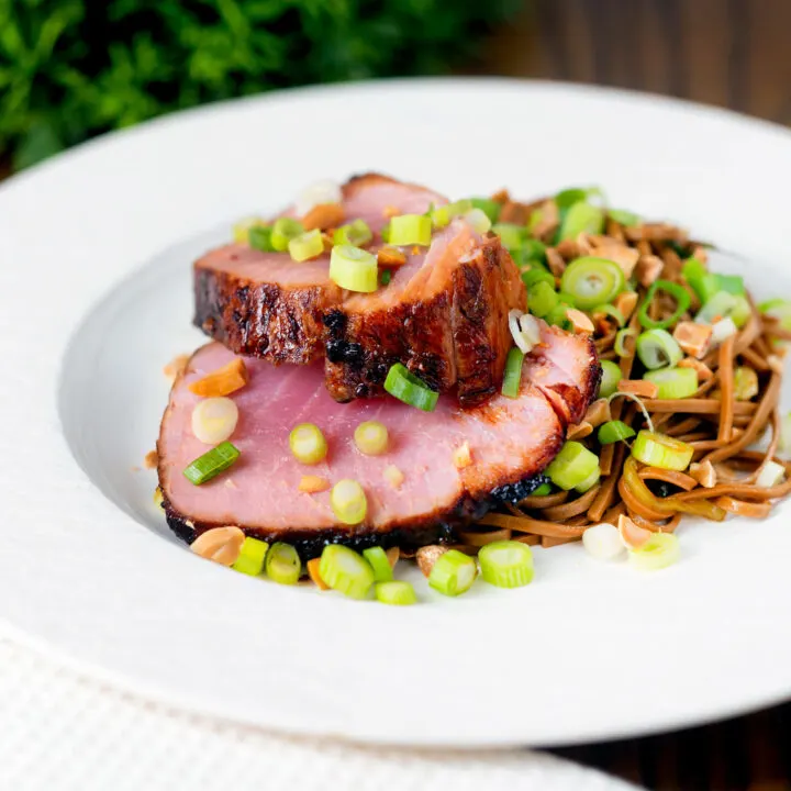 Baked tuna steak with a honey, soy sauce and ginger glaze served with noodle salad.