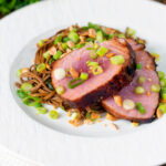Baked tuna steak with a honey and soy glaze served with a soba noodle salad.
