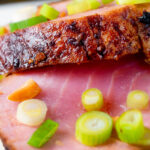 Close-up roasted tuna steak with a honey and soy glaze.