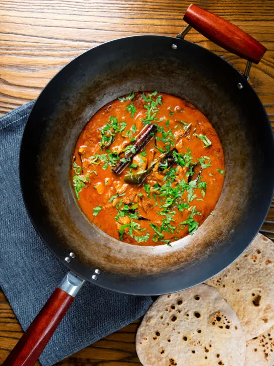 Overhead Sri Lankan influenced chicken Ceylon curry served in a wok.