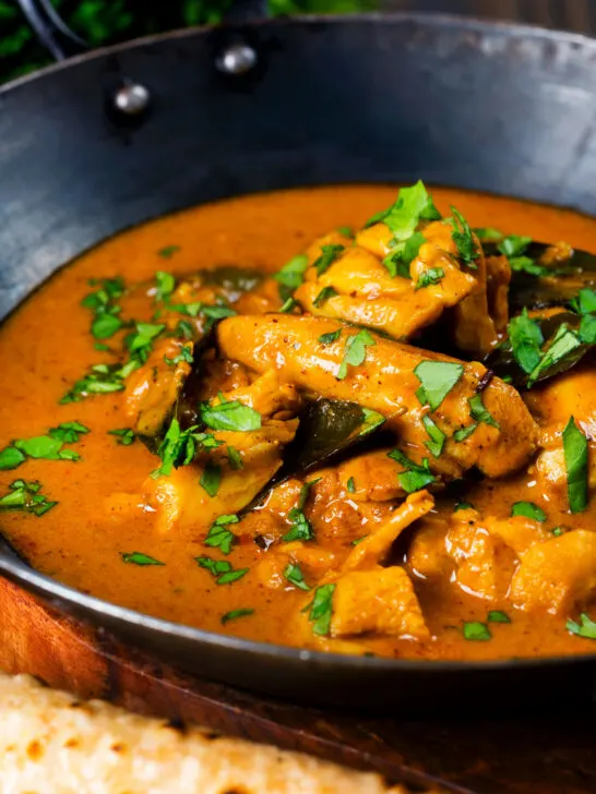 Close-up Sri Lankan influenced chicken Ceylon curry with homemade chapatis.