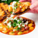 Chorizo and butterbean stew with crumbled feta cheese being eaten with toast featuring a title overlay.