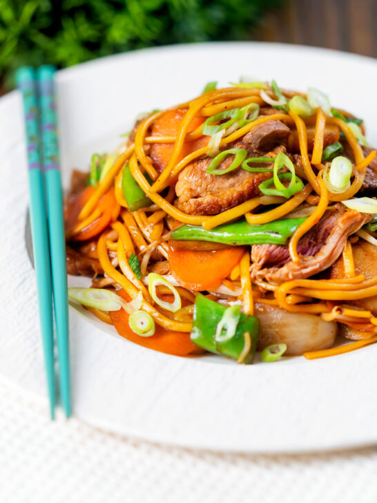 Hoisin duck chow mein stir fry with noodles, carrots and runner beans.