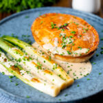 Individual English ham, potato and apple fidget pie with a cider sauce and leeks.