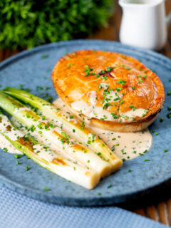 Individual English ham, potato and apple fidget pie with a cider sauce and leeks.