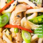 Close-up ginger chicken udon noodle stir fry with chilli and spring onions featuring a title overlay.