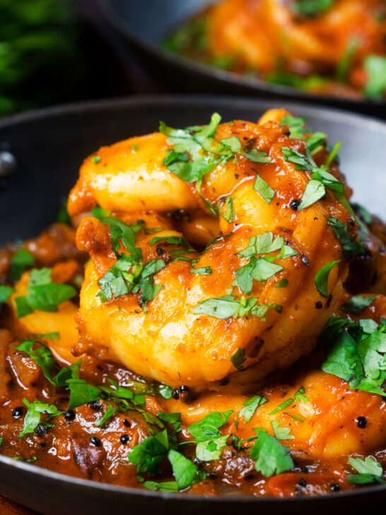 Close-up king prawn or shrimp bhuna served with fresh coriander.