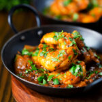 Indian king prawn or shrimp bhuna curry served with fresh coriander.