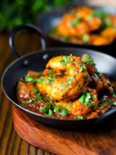 Indian king prawn or shrimp bhuna curry served with fresh coriander.