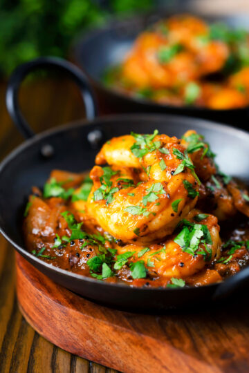 Indian king prawn or shrimp bhuna curry served with fresh coriander.