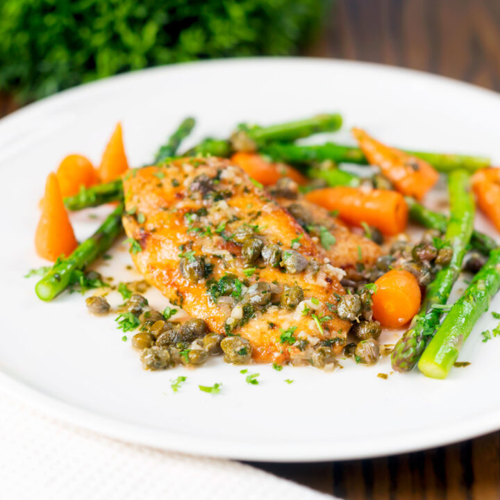 Pan-fried quick chicken piccata with capers, white wine and lemon served with asparagus and carrots.