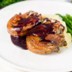 Minted lamb chops with red wine sauce, mashed potato and asparagus.