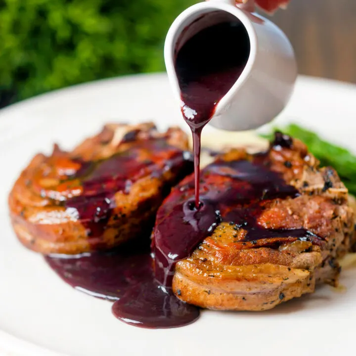 Pan-cooked thick-cut minted lamb chops with a rich red wine sauce.
