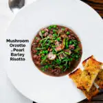 Overhead mushroom pearl barley risotto or orzotto cooked with red wine and peas featuring a title overlay.