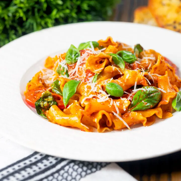 Easy Nduja sausage pasta with fresh baby San Marzano tomatoes and basil.