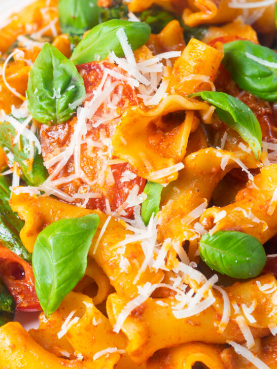 Close-up spicy nduja pasta made with Fiorelli, tomatoes and fresh basil.