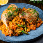 Traditional Valencian paella with chicken thighs and rabbit legs served on a blue plate featuring a title overlay.