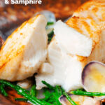 Pan fried halibut fillet with clams and samphire opened to show the white flesh featuring a title overlay.