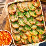 Overhead corned beef and potato bake or panacalty with baked beans featuring a title overlay.