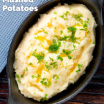 Overhead creamy, buttery and perfectly fluffy mashed potatoes with fresh parsley garnish featuring a title overlay.