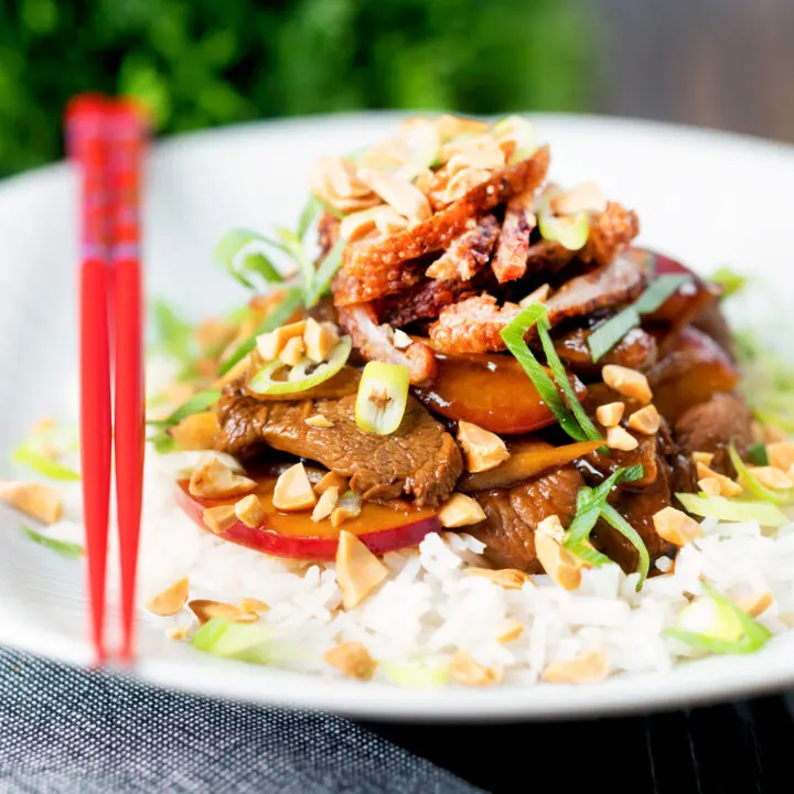 Fresh plum and duck stir fry with crispy skin, toasted peanuts and spring onions.