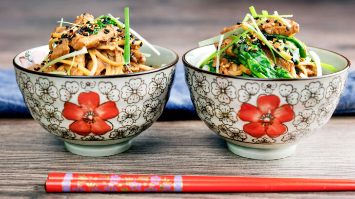 Tenderloin pork noodle stir fry with garlic, Szechuan pepper and spinach.